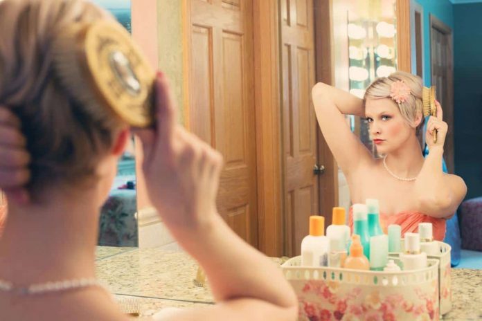 woman-using-hair-brush-39250